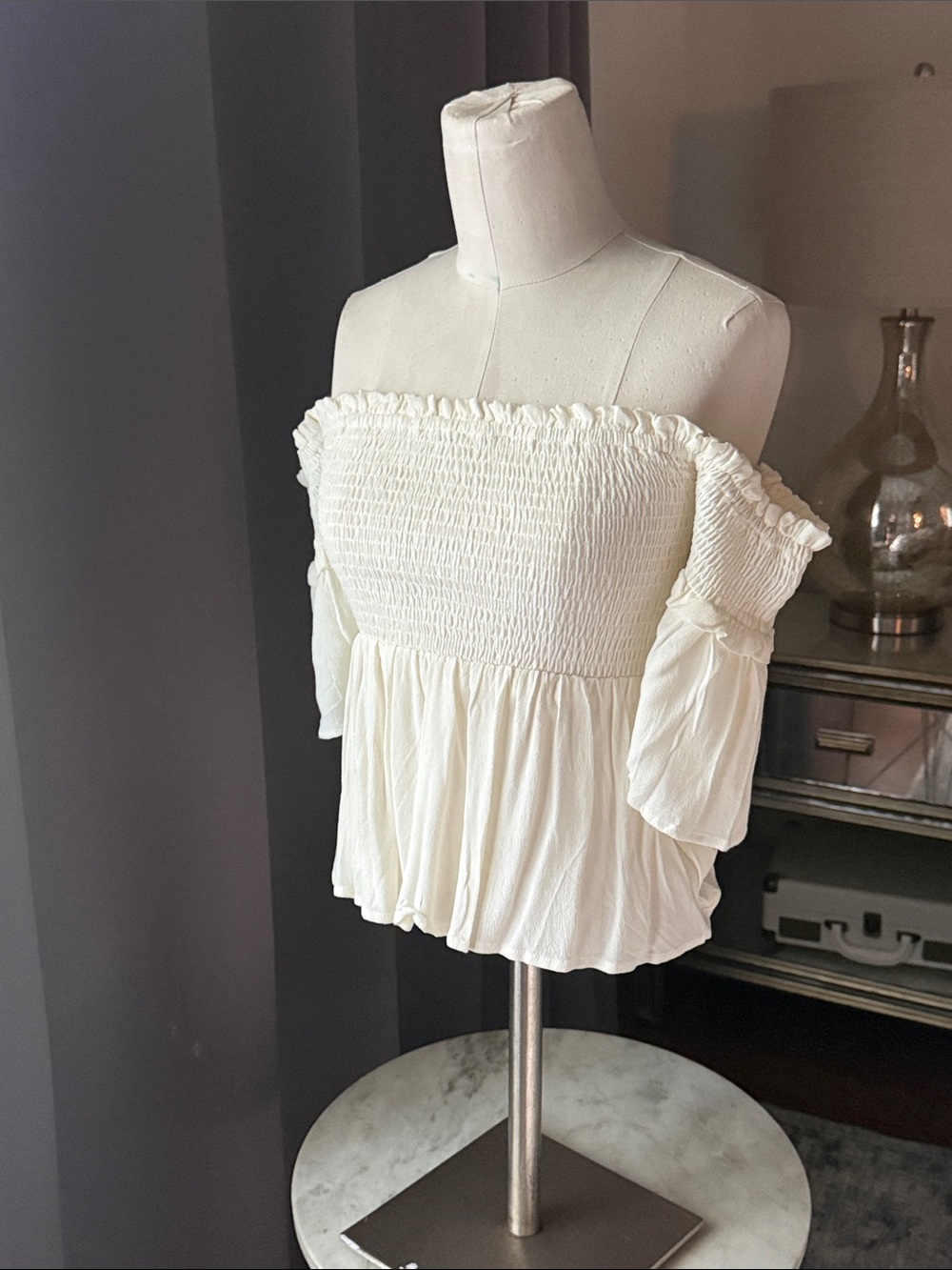 Smocked Off-Shoulder Peplum Blouse in Cream